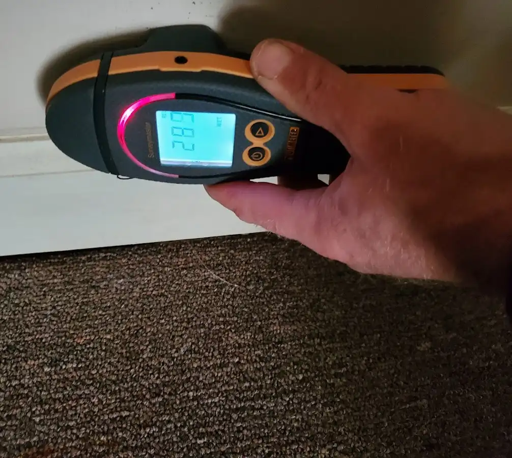 Moisture detection at baseboard during Storm Damage Restoration in Norwich